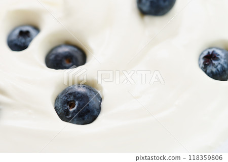 Closeup of fresh blueberries in white yogurt 118359806