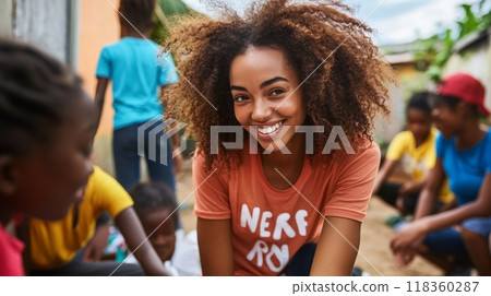 A smiling young woman in a white shirt stands outdoors with friends in the background. The image is set against a natural, blurred background, capturing a sense of friendship and happiness. A smiling young woman in a white shirt stands outdoors with friends in the background. The image is set against a natural, blurred background, capturing a sense of friendship and happiness. 118360287