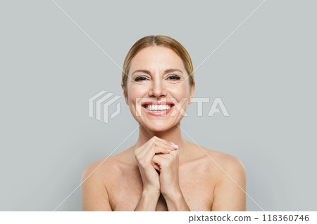 Face, skincare and antiaging concept. Happy cheerful mature woman, studio portrait Face, skincare and antiaging concept. Happy cheerful mature woman, studio portrait 118360746