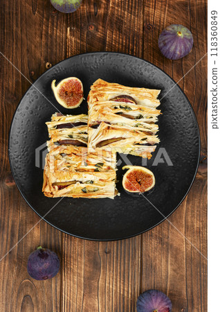 Homemade pie topped with fresh figs Homemade pie topped with fresh figs 118360849