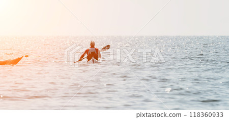 Kayaking, Sea, Sunset - Man Kayaking in Ocean at Sunset. 118360933