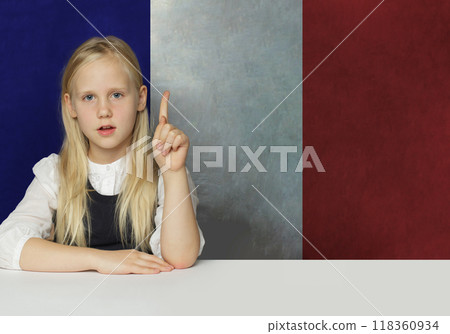 Cheerful young child girl an French flag background. Education in France Cheerful young child girl an French flag background. Education in France 118360934
