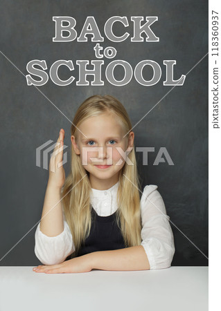 Happy school girl child student against blackboard background with Back to school inscription Happy school girl child student against blackboard background with Back to school inscription 118360937