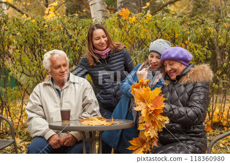 Happy family relaxing outdoor in autumn 118360980