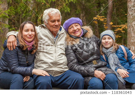Close-up outdoors portrait of joyful family generation in park in autumn, portrait Close-up outdoors portrait of joyful family generation in park in autumn, portrait 118361043