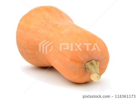 pumpkin in the shape of a pear lies on its side on a white background, close-up pumpkin in the shape of a pear lies on its side on a white background, close-up 118361173