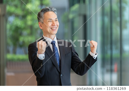 Businessman senior portrait fist pump Businessman senior portrait fist pump 118361269