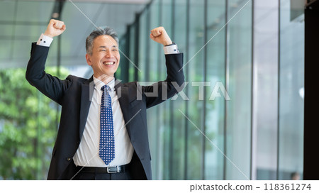 Businessman senior portrait fist pump 118361274