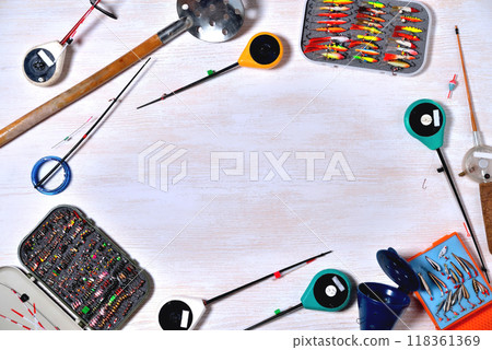 accessories for winter fishing on a light wooden background, place for an inscription accessories for winter fishing on a light wooden background, place for an inscription 118361369