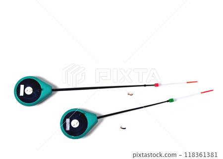 Fitted fishing rods for winter fishing on a white background, close-up Fitted fishing rods for winter fishing on a white background, close-up 118361381