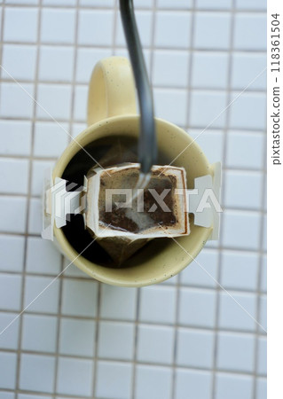 yellow cup freshly brewed coffee with convenient drip filter on table. prepare freshly brewed coffee yellow cup freshly brewed coffee with convenient drip filter on table. prepare freshly brewed coffee 118361504