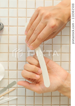 top view of woman doing manicure at home, taking care of her nails and hands. manicure process top view of woman doing manicure at home, taking care of her nails and hands. manicure process 118361508