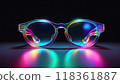 Metallic and translucent eyeglass frames and lenses with iridescent sheen. Dark black background. 118361887
