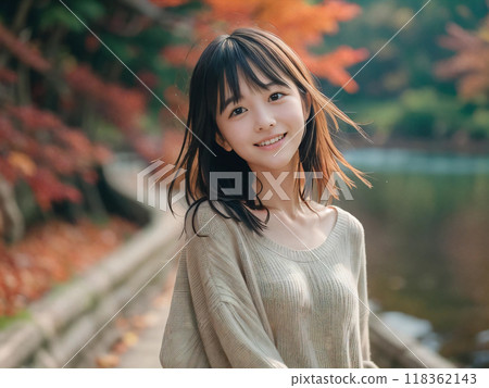 Autumn leaves landscape and smiling young woman Autumn leaves landscape and smiling young woman 118362143