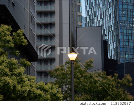 Evening city office district skyscrapers and park lights landscape Evening city office district skyscrapers and park lights landscape 118362927