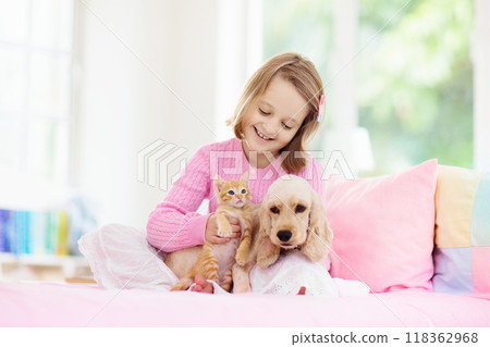 Child, dog and cat. Kids play with puppy, kitten. 118362968