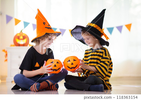 Kids in witch costume on Halloween trick or treat Kids in witch costume on Halloween trick or treat 118363154