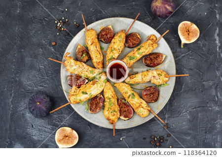 Homemade chicken skewers with figs chutney. Homemade chicken skewers with figs chutney. 118364120