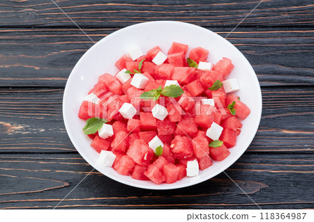 Summer watermelon salad with feta cheese and mint 118364987