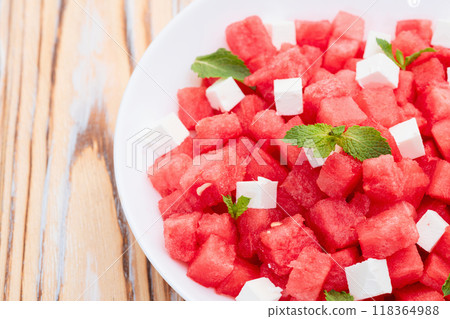 Summer watermelon salad with feta cheese and mint 118364988