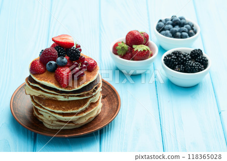 Stack of homemade american pancakes with berries . Top view Stack of homemade american pancakes with berries . Top view 118365028