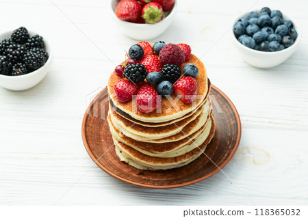 Stack of homemade american pancakes with berries . Top view Stack of homemade american pancakes with berries . Top view 118365032