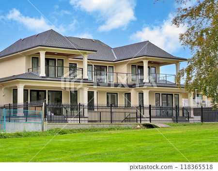 A perfect neighbourhood. New luxury residential house on cloudy sky background A perfect neighbourhood. New luxury residential house on cloudy sky background 118365518