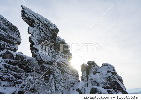 syenite granite rocks in hoarfrost, similar to a bird's wing, winter landscape syenite granite rocks in hoarfrost, similar to a bird's wing, winter landscape 118365539