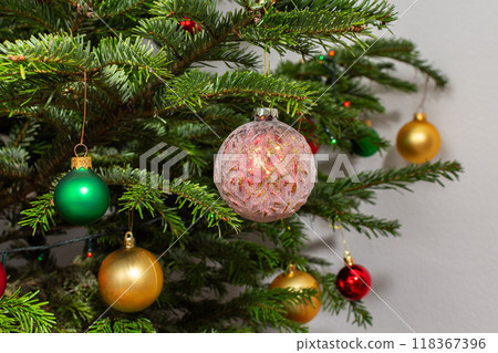 Christmas balls on a green festive tree 118367396