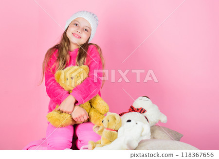 Kid little girl play with soft toy teddy bear pink background. Unique attachments to stuffed animals. Child small girl playful hold teddy bear plush toy. Teddy bears improve psychological wellbeing Kid little girl play with soft toy teddy bear pink background. Unique attachments to stuffed animals. Child small girl playful hold teddy bear plush toy. Teddy bears improve psychological wellbeing 118367656
