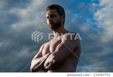 shirtless muscular man. adult man with muscular torso. athletic man on sky background 118367752
