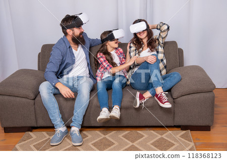 happy parents with kid girl use modern technology. mom dad and daughter. 118368123