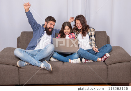 happy mother father and daughter use computer, family 118368126