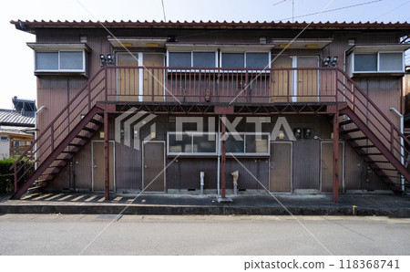 A two-storey apartment building, a dilapidated boarding house, an apartment building with broken windows. A two-storey apartment building, a dilapidated boarding house, an apartment building with broken windows. 118368741