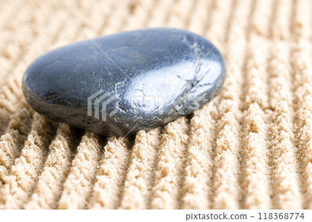 Black stone in zen garden Black stone in zen garden 118368774