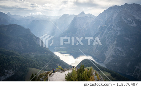 Mountain summit lookout with high rocky peaks and walls surrounding lake on its bottom, Germany 118370497