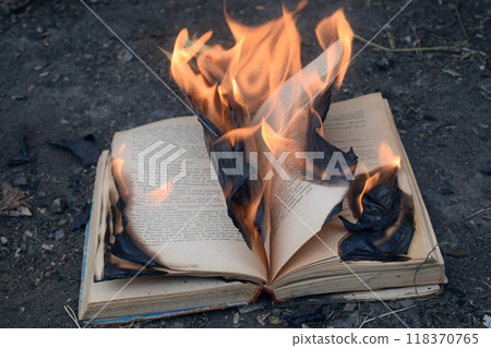 The photo shows a brightly burning book, The photo shows a brightly burning book, 118370765