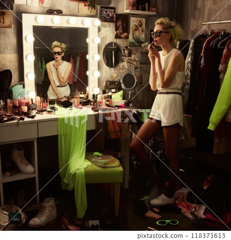 Woman in a messy dressing room, applying lipstick with an effortlessly cool attitude. Sporty sunglasses, neon green accessories, and sheer tights scattered around.. Brat or it girl style fashion conce Woman in a messy dressing room, applying lipstick with an effortlessly cool attitude. Sporty sunglasses, neon green accessories, and sheer tights scattered around.. Brat or it girl style fashion conce 118371613