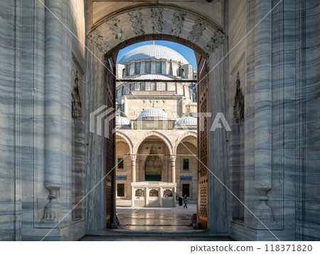 Suleymaniye Mosque detailed architecture, featuring its grand dome and ornate entrance, built by Mimar Sinan during the Ottoman Empire. 118371820