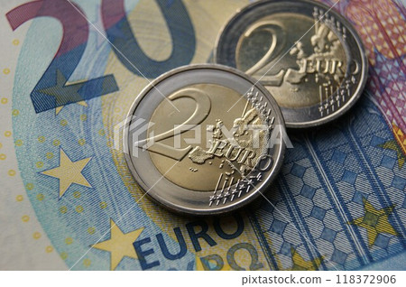 European money. 2 Euro coins on a banknote. 118372906