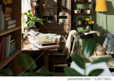 Cozy Home Office with Vintage Rotary Phone on Wooden Desk 118373603
