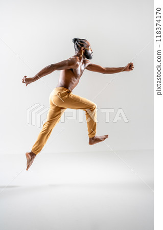 Black gay man running isolated on white background Black gay man running isolated on white background 118374170