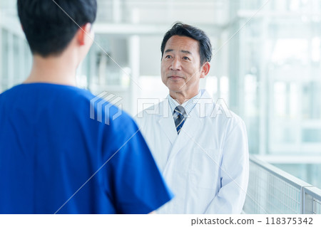 Doctor and nurse consulting Doctor and nurse consulting 118375342