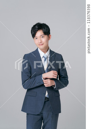 A young man in a suit A young man in a suit 118376398