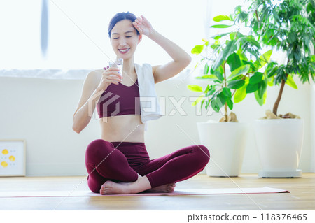 A woman drinking water A woman drinking water 118376465