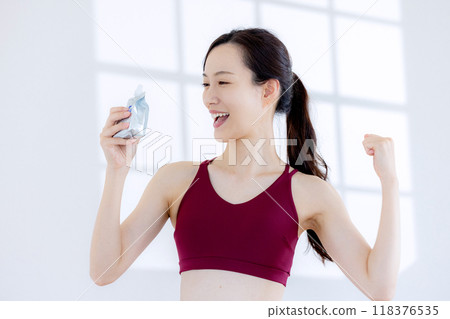 Woman drinking jelly Woman drinking jelly 118376535