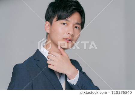 A young man in a suit A young man in a suit 118376840