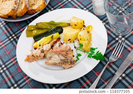 Appetizing rabbit with potatoes and vegetables Appetizing rabbit with potatoes and vegetables 118377105