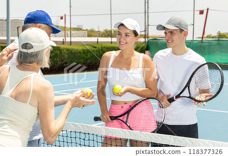 Portrait of smiling tennis team. Portrait of smiling tennis team. 118377326
