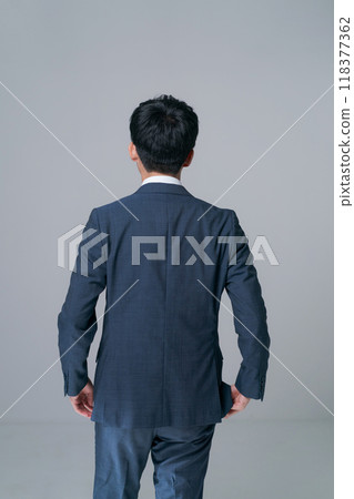 Back view of a man standing in a suit 118377362